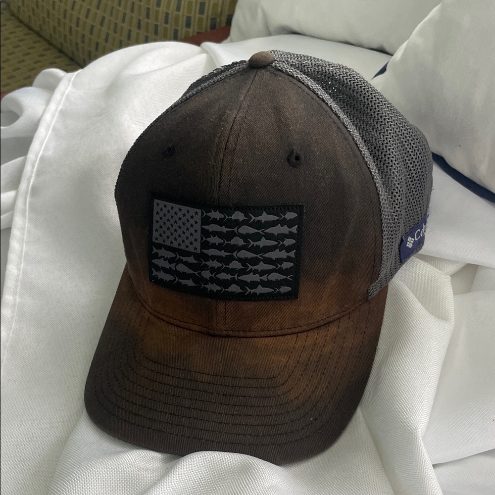 Columbia Black and Brown Fish Flag Cap rustic look.